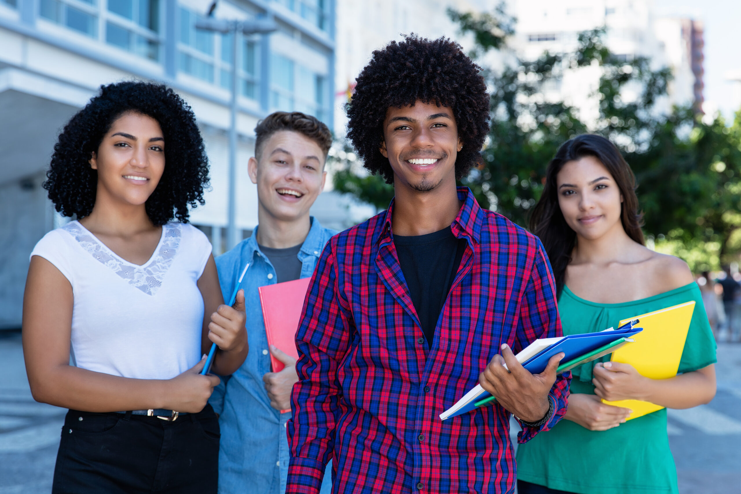 African american student with group of latin and hispanic and caucasian students